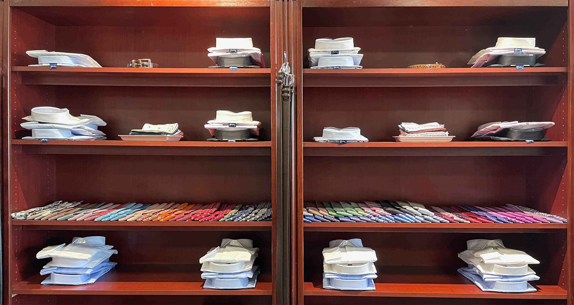 Formal dress shirts stacked display in JwR's store.